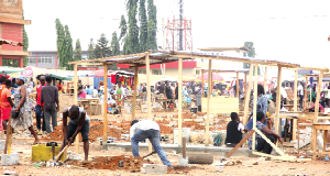 Some traders constructing structures for their wares at the Redco Market