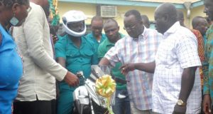 Dr Owusu Afriyie Akoto (second right) symbolically starting the engine of one of the motorbikes